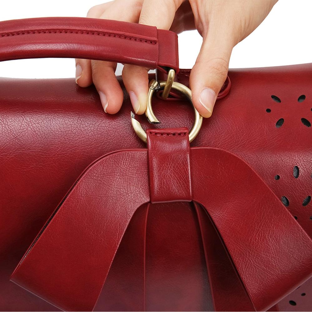 Monikas stilvolle Schleifenhandtasche