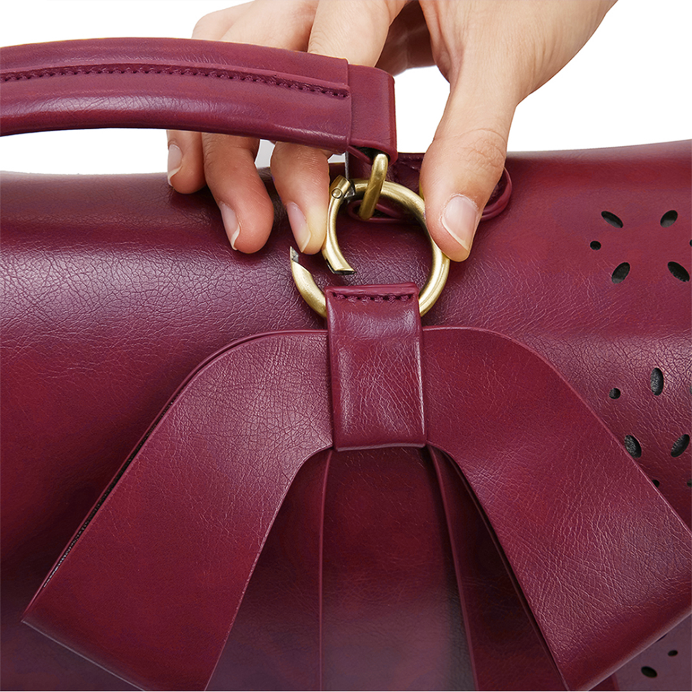 Monikas stilvolle Schleifenhandtasche