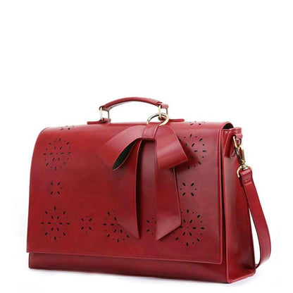 Monikas stilvolle Schleifenhandtasche